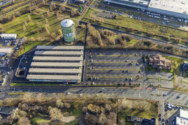 Aerial view, gasometer Herne, industrial area Lindenallee, Holsterhausen, Herne, Ruhr area, North Rhine-Westphalia, Germany, DE, DECATHLON Herne, Europe, commercial enterprises, commercial area, commercial park, commercial location, commercial use, industrial facilities, industrial area, industrial location, aerial view, aerial photography, aerial photography, Rhine-Ruhr metropolitan region, overview, bird's-eye view, overview, sports shop, discount store, Hibernia dog meadow, Hibernia industrial area