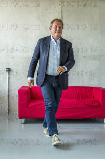 DEU Germany Germany Berlin The federal chairman of the Verdi trade union, Frank Bsirske, poses in the Taz building
