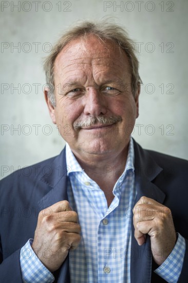 DEU Germany Germany Berlin The federal chairman of the Verdi trade union, Frank Bsirske, poses in the Taz building