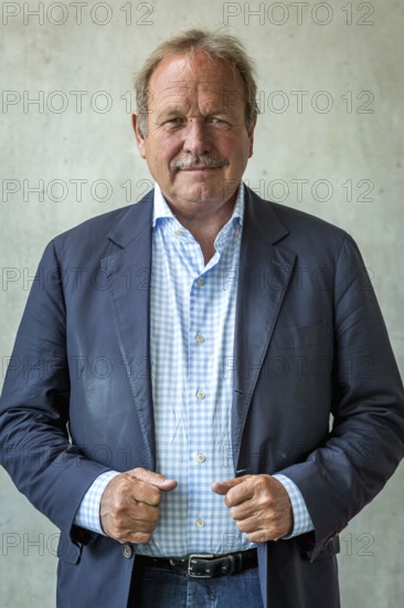 DEU Germany Germany Berlin The federal chairman of the Verdi trade union, Frank Bsirske, poses in the Taz building