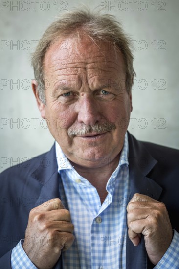 DEU Germany Germany Berlin The federal chairman of the Verdi trade union, Frank Bsirske, poses in the Taz building