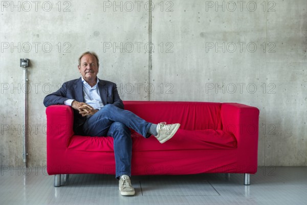 DEU Germany Germany Berlin The federal chairman of the Verdi trade union, Frank Bsirske, poses in the Taz building