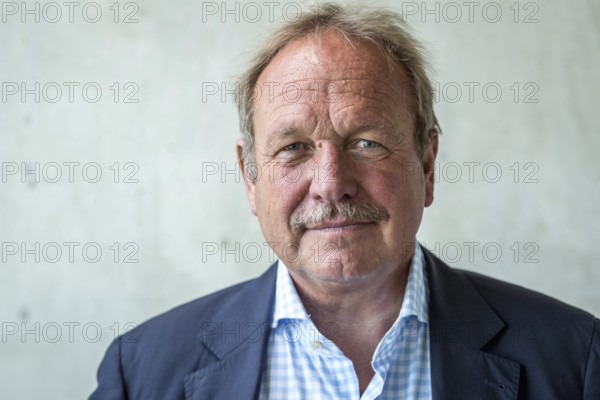DEU Germany Germany Berlin The federal chairman of the Verdi trade union, Frank Bsirske, poses in the Taz building
