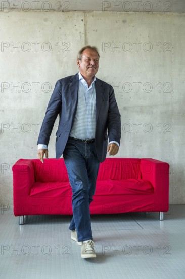 DEU Germany Germany Berlin The federal chairman of the Verdi trade union, Frank Bsirske, poses in the Taz building