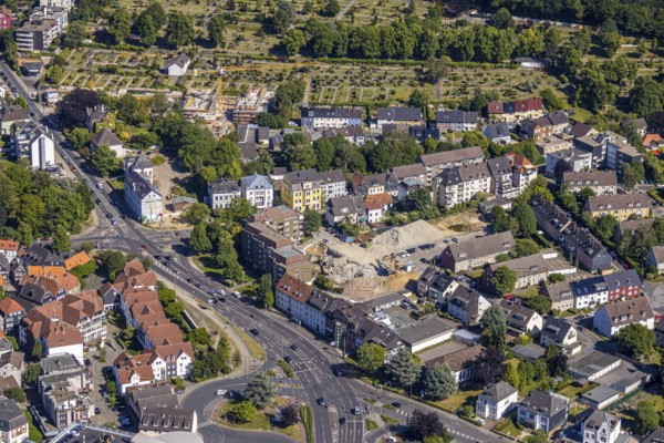 Aerial view, construction site new residential quarter Mörikestraße, former fire station, construction site new residential buildings, former Opel car dealership Brinkmann site, Bredenscheider Straße, Evang. cemetery am Wasserturm, Hattingen, Ruhr area, North Rhine-Westphalia, Germany, construction work, construction area, building site, building plots, construction crane, construction project, construction site, burial site, DE, Ennepe-Ruhr-Kreis, Europe, cemetery, memorial, place of worship, graves, burial ground, aerial photograph, aerial photography, aerial photography, new construction, resting place, overview, bird's-eye view, residential area, living and living, residential neighbourhood, birds-eyes view, overview