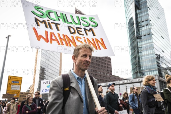 DEU Germany Germany Berlin Protests for climate protection. Modulor founder Christoph Struhk walks across Potsdamer Platz during the entrepreneurs for future demonstration