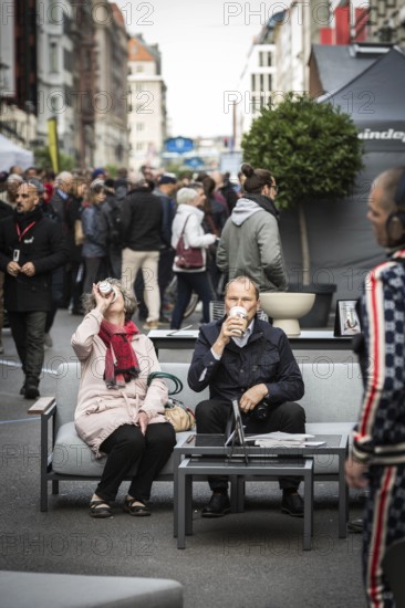 DEU Germany Germany Berlin Part of Friedrichsstrasse is closed to traffic at the weekend. Pedestrians use the street for a stroll or to sit on a sofa