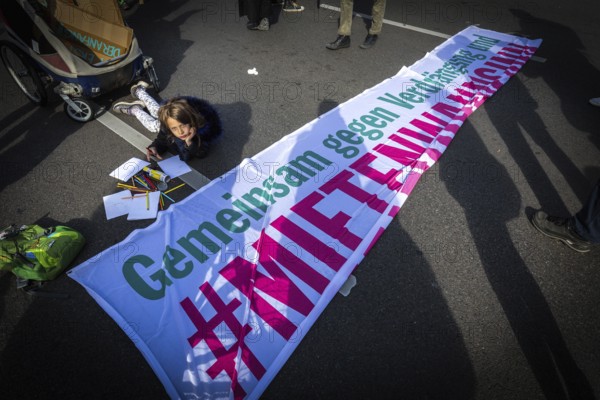 DEU Germany Germany Berlin Demonstration against rent increases and gentrification.child paints in front of the start of the protest march