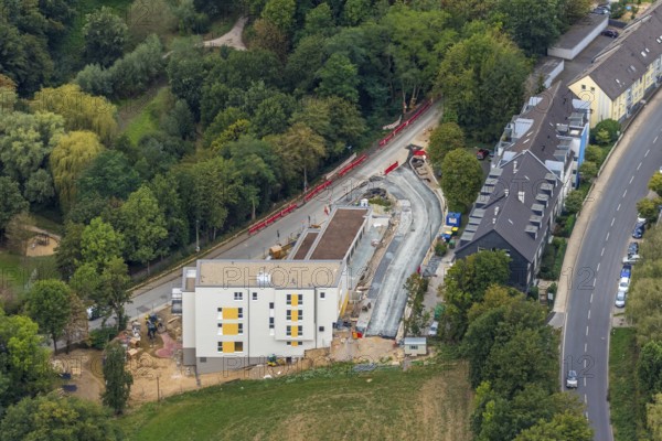 Aerial view, construction site, new multi-family house with day care centre, Elisabeth-Selbert-Straße, Kurt-Schumacher-Straße, Heiligenhaus, Ruhr area, North Rhine-Westphalia, Germany, construction work, building, construction area, building site, building plots, construction project, construction site, DE, Europe, property tax, real estate, kindergarten, day nursery, day care centre, day nursery, aerial view, aerial photography, aerial photography, new building, overview, bird's-eye view, residential complex, housing and living, residential area, residential buildings, residential quality, residential quarter, housing estate, birds-eyes view, overview