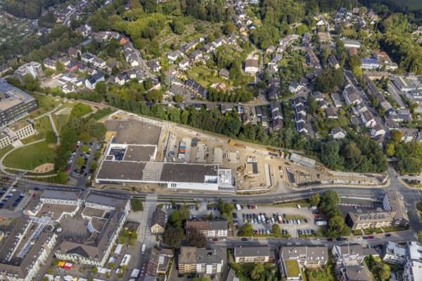 Aerial view, construction site new building at Hefelmann-Park, shopping centre, Westfalenstraße, former Kiekert site, Heiligenhaus, Ruhr area, North Rhine-Westphalia, Germany, Am Hefelmann-Park, construction work, construction, construction area, building site, building plots, construction measure, construction project, construction site, DE, Europe, aerial view, aerial photography, aerial photography, new building, panorama cycle path, overview, bird's-eye view, overview, local supply centre, former foundry Hitzbleck