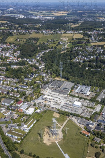 Aerial view, industrial estate Loerfeld, Basamentwerke Böcke GmbH, construction site power line, end, Herdecke, Ruhr area, North Rhine-Westphalia, Germany, construction work, construction area, construction site, construction measure, construction project, construction site, DE, Europe, commercial area, commercial area, commercial use, green trees, industrial site, Loerfeldstraße, aerial view, aerial photography, aerial photography, power pylons, power line, overview, bird's eye view, birds-eyes view, overview