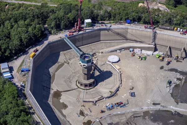 Aerial photo, RWE has completely emptied the large upper reservoir for the main inspection at the Herdecke pumped storage power plant. The plant will be off the grid for a few weeks, storage reservoir, RWE pumped storage power plant, Köpchenwerk, Herdecke, Ruhr area, North Rhine-Westphalia, Germany<, construction work, construction area, construction measure, construction project, construction site, DE, Germany, Europe, Ruhr river, Hengsteysee, aerial photograph, aerial photography, aerial photography, pumped storage power plant Köpchenwerk, RWE, lake, overview, bird's-eye view, forest area, birds-eyes view, overview