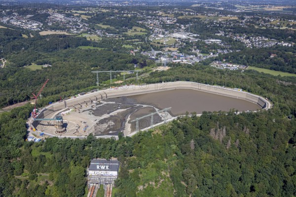 Aerial photo, RWE has completely emptied the large upper reservoir for the main inspection at the Herdecke pumped storage power plant. The plant will be off the grid for a few weeks, storage reservoir, RWE pumped storage power plant, Köpchenwerk, Herdecke, Ruhr area, North Rhine-Westphalia, Germany<, construction work, construction area, construction measure, construction project, construction site, DE, Germany, Europe, Ruhr river, Hengsteysee, aerial photograph, aerial photography, aerial photography, pumped storage power plant Köpchenwerk, RWE, lake, overview, bird's-eye view, forest area, birds-eyes view, overview