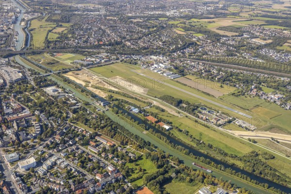 Aerial view, Hamm airfield, Mattenbecke sewage treatment plant, Lippe floodplain, Datteln-Hamm canal, River Lippe, Hamm, Ruhr area, North Rhine-Westphalia, Germany, wastewater treatment plant, wastewater treatment, construction area, construction site, building site, construction project, construction site, DE, Europe, flight emission, airport, aircraft noise, airfield, airfield site, sewage treatment plant, runway, aerial view, aerial photography, aerial photography, Münsterstrasse, runway, overview, bird's-eye view, water treatment plant, water purification plant, birds-eyes view, overview