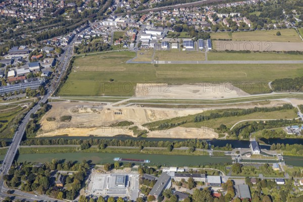 Aerial view, Hamm airfield, Lippe floodplain, Hamm lock, Lippe river, Datteln-Hamm canal, construction site, Hamm, Ruhr area, North Rhine-Westphalia, Germany, wastewater treatment plant, wastewater treatment, DE, Europe, flight emission, airport, aircraft noise, airfield, airfield area, sewage treatment plant, runway, aerial view, aerial photography, aerial photography, Münsterstraße, runway, overview, bird's eye view, water treatment plant, water purification plant, birds-eyes view, overview