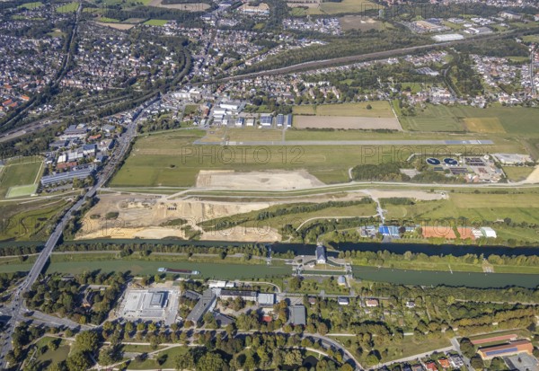Aerial view, Hamm airfield, Mattenbecke sewage treatment plant, Lippe floodplain, Hamm lock, Lippe river, Datteln-Hamm canal, construction site, Hamm, Ruhr area, North Rhine-Westphalia, Germany, wastewater treatment plant, wastewater treatment, DE, Europe, flight emission, airport, aircraft noise, airfield, airfield site, sewage treatment plant, runway, aerial photograph, aerial photography, aerial photography, Münsterstrasse, runway, overview, bird's-eye view, water treatment plant, water purification plant, birds-eyes view, overview
