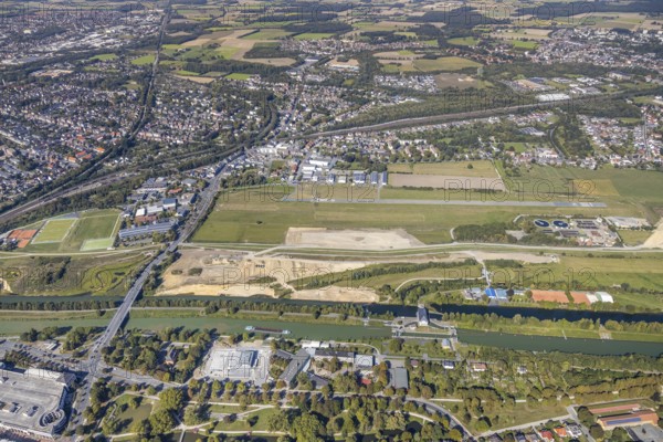 Aerial view, Hamm airfield, Mattenbecke sewage treatment plant, Lippe floodplain, Hamm lock, Lippe river, Datteln-Hamm canal, construction site, Hamm, Ruhr area, North Rhine-Westphalia, Germany, wastewater treatment plant, wastewater treatment, DE, Europe, flight emission, airport, aircraft noise, airfield, airfield site, sewage treatment plant, runway, aerial photograph, aerial photography, aerial photography, Münsterstrasse, runway, overview, bird's-eye view, water treatment plant, water purification plant, birds-eyes view, overview