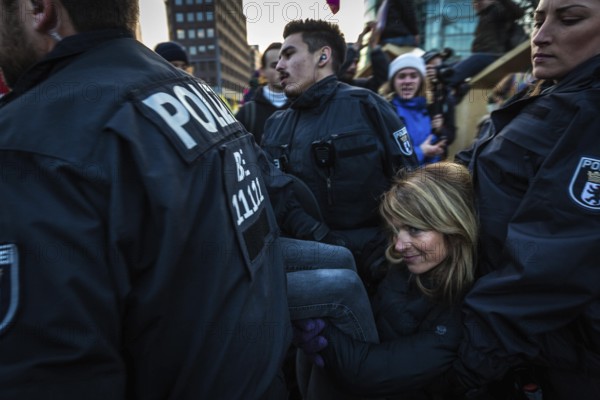 DEU Germany Germany Berlin Demonstrators of the Extinction Rebellion movement during the occupation of Potsdamer Platz.police officers clear activists of a sit-in blockade on Potsdamer Platz