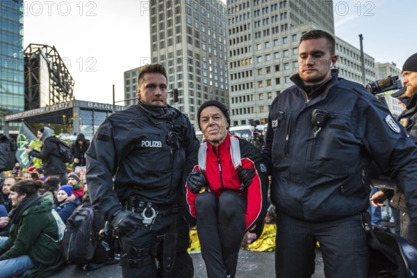 DEU Germany Germany Berlin Demonstrators of the Extinction Rebellion movement during the occupation of Potsdamer Platz.police officers clear activists of a sit-in blockade on Potsdamer Platz