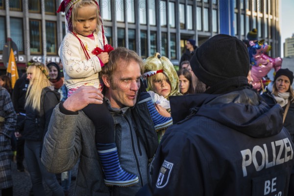 DEU Germany Germany Berlin Protesters of the Extinction Rebellion movement during the occupation of Potsdamer Platz.father with children discussing with police officers