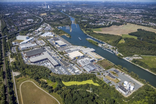 Aerial view, lock Herne-Ost, industrial estate Friedrich der Große, boats at the jetty, mooring place Automobilclub und Motorbootclub Castrop-Rauxel, Rhine-Herne-Canal, water sports club Herne 1920, Herne, Ruhr area, North Rhine-Westphalia, Germany, boats, DACHSER SE, DE, Europe, commercial enterprises, commercial area, commercial area, commercial park, commercial location, commercial use, green trees, Herner Meer, industrial plants, industrial area, industrial location, aerial view, aerial photography, aerial photography, Rhine-Ruhr metropolitan region, motorboats, swimming pool, overview, bird's-eye view, overview