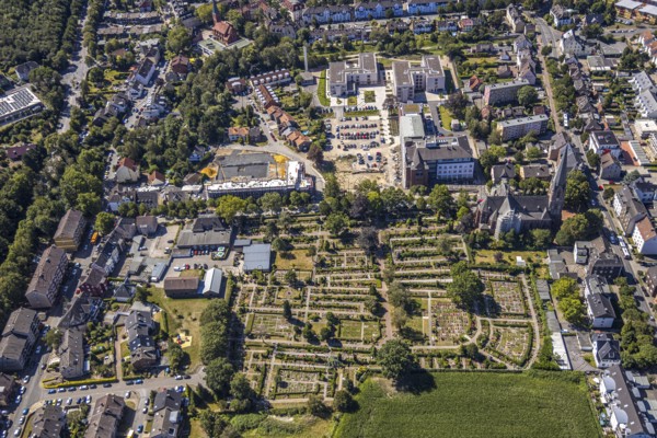 Aerial view, construction site Widumer Höfe, the future retirement home of the St Elisabeth Group, St Peter and Paul Catholic Church, Widumer Strasse Catholic Cemetery, Herne, Ruhr area, North Rhine-Westphalia, Germany. Widumer Straße cemetery, Herne, Ruhr area, North Rhine-Westphalia, Germany, retirement home, retirement home, retirement home, place of worship, construction work, construction, construction area, construction site, construction site, construction project, construction site, burial site, care and nursing, DE, Europe, cemetery, memorial site, religious community, place of worship, house of worship, crypt, graves, burial ground, church, parish, denomination, aerial view, aerial photography, aerial photography, Rhine-Ruhr metropolitan region, new building, care facility, religion, resting place, retirement home, retirement residence, retirement home, retirement centre, overview, bird's-eye view, bird's-eye view, overview