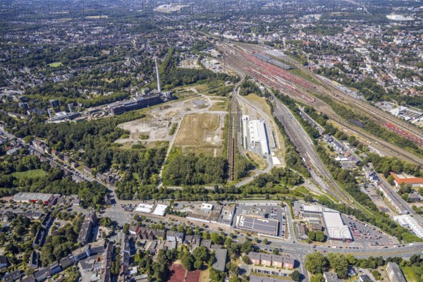 Aerial view, construction site new Stadler Rail Vehicles branch, former General Blumenthal mine site, former Uniper Shamrock power plant, Herne, Ruhr area, North Rhine-Westphalia, Germany, railway tracks, railway station, DE, Deutsche Bahn AG, Europe, commercial enterprises, commercial area, commercial area, commercial location, commercial use, main station, industrial facilities, industrial area, industrial location, Kastanienallee, aerial view, aerial photography, aerial photography, Rhine-Ruhr metropolitan region, signal box, overview, bird's-eye view, Wanne-Eickel main station, birds-eyes view, overview