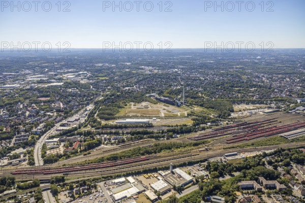 Aerial view, construction site new Stadler Schienenfahrzeuge branch, former General Blumenthal mine site, former Uniper Shamrock power plant, Herne, Ruhr area, North Rhine-Westphalia, Germany, railway tracks, DE, Europe, commercial enterprises, commercial area, commercial site, commercial use, industrial plants, industrial area, industrial site, Kastanienallee, aerial view, aerial photography, aerial photography, metropolitan region Rhine-Ruhr, signal box, overview, bird's eye view, bird's eye view, overview