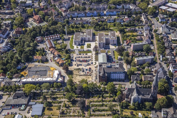 Aerial view, construction site Widumer Höfe, the future retirement home of the St Elisabeth Group, St Peter and Paul Catholic Church, Widumer Straße Catholic Cemetery, Herne, Ruhr area, North Rhine-Westphalia, Germany. Widumer Straße cemetery, Herne, Ruhr area, North Rhine-Westphalia, Germany, retirement home, retirement home, retirement home, place of worship, construction work, construction, construction area, construction site, construction site, construction project, construction site, burial site, care and nursing, DE, Europe, cemetery, memorial site, religious community, place of worship, house of worship, crypt, graves, burial ground, church, parish, denomination, aerial view, aerial photography, aerial photography, Rhine-Ruhr metropolitan region, new building, care facility, religion, resting place, retirement home, retirement residence, retirement home, retirement centre, overview, bird's-eye view, birds-eyes view, overview
