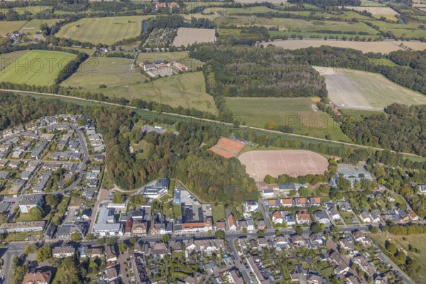 Aerial photograph, forest canal dump and old landfill, Haus Maximilian nursing home, Datteln-Hamm canal, sports field, tennis court, Am Wellenbad, Maximilianschule Hamm, Werries, Hamm, Ruhr area, North Rhine-Westphalia, Germany, retirement home, old people's home, care and nursing, education, educational institution, DE, Europe, football pitch, football stadium, football club, educational institute, aerial view, aerial photography, aerial photography, care facility, school, retirement home, retirement residence, retirement home, retirement centre, sports, sports facilities, sports facility, stadium, tennis, tennis facility, tennis courts, tennis club, overview, bird's-eye view, forest, forest area, birds-eyes view, overview
