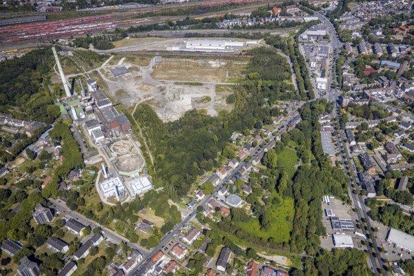 Aerial view, construction site new Stadler Schienenfahrzeuge branch, former General Blumenthal mine site, former Uniper Shamrock power plant, Herne, Ruhr area, North Rhine-Westphalia, Germany, railway tracks, DE, Europe, commercial enterprises, commercial area, commercial site, commercial use, industrial plants, industrial area, industrial site, Kastanienallee, aerial view, aerial photography, aerial photography, metropolitan region Rhine-Ruhr, signal box, overview, bird's eye view, bird's eye view, overview