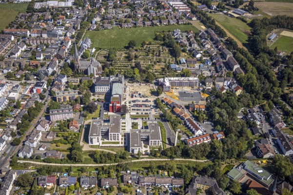 Aerial view, construction site Widumer Höfe, the future retirement home of the St Elisabeth Group, St Peter and Paul Catholic Church, Widumer Strasse Catholic Cemetery, Herne, Ruhr area, North Rhine-Westphalia, Germany. Widumer Straße cemetery, Herne, Ruhr area, North Rhine-Westphalia, Germany, retirement home, retirement home, retirement home, place of worship, construction work, construction, construction area, construction site, construction site, construction project, construction site, burial site, care and nursing, DE, Europe, cemetery, memorial site, religious community, place of worship, house of worship, crypt, graves, burial ground, church, parish, denomination, aerial view, aerial photography, aerial photography, Rhine-Ruhr metropolitan region, new building, care facility, religion, resting place, retirement home, retirement residence, retirement home, retirement centre, overview, bird's-eye view, bird's-eye view, overview