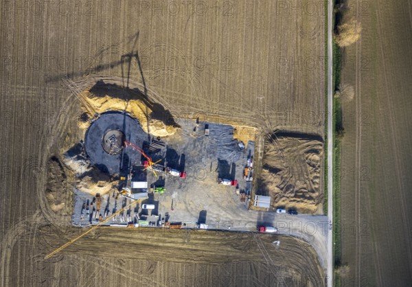 Aerial photo, construction site for wind turbines, Hellweg, near the A2 motorway, Rhynern, Hamm, Ruhr area, North Rhine-Westphalia, Germany, construction work, construction, construction area, construction site, construction site, construction project, construction site, DE, Europe, aerial photo, aerial photography, aerial photography, new construction, overview, bird's eye view, WTG, meadows and fields, wind energy, wind turbine, wind power, wind turbine, wind turbines, bird's eye view, overview