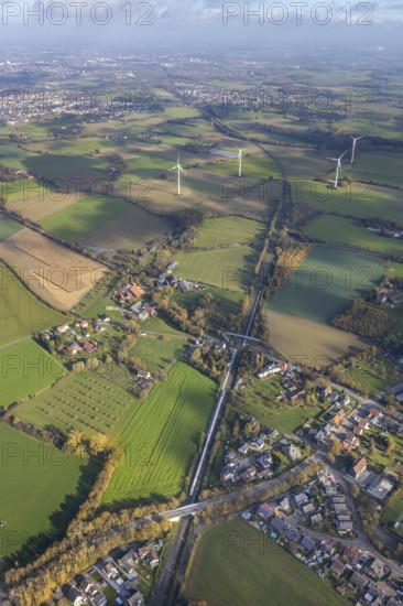 Aerial view, Bönen-Nordbögge railway station, view to Pelkum, Pelkum, Hamm, Ruhr area, North Rhine-Westphalia, Germany, railway tracks, railway station, bridge, DE, Deutsche Bahn AG, Europe, distant view, pedestrian bridge, main station, aerial view, aerial photography, aerial photography, overview, bird's-eye view, wind energy, wind energy plant, wind power, wind power plant, wind turbines, birds-eyes view, overview