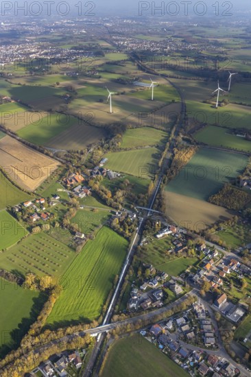 Aerial view, Bönen-Nordbögge railway station, view to Pelkum, Pelkum, Hamm, Ruhr area, North Rhine-Westphalia, Germany, railway tracks, railway station, bridge, DE, Deutsche Bahn AG, Europe, distant view, pedestrian bridge, main station, aerial view, aerial photography, aerial photography, overview, bird's-eye view, wind energy, wind energy plant, wind power, wind power plant, wind turbines, birds-eyes view, overview