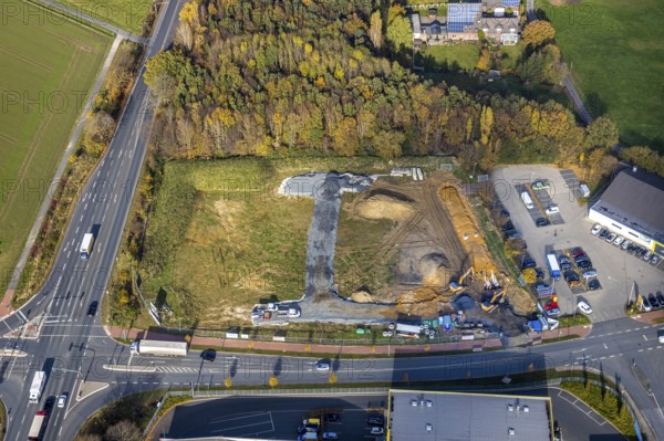 Aerial view, construction area for Galerie Mensing at the intersection of Werler Straße and Unnaer Straße, Hamm, Ruhr area, North Rhine-Westphalia, Germany, construction work, construction, construction area, building site, building plots, construction project, construction site, DE, Europe, commercial enterprises, commercial area, commercial area, commercial location, commercial use, aerial view, aerial photography, aerial photography, new construction, overview, bird's-eye view, overview