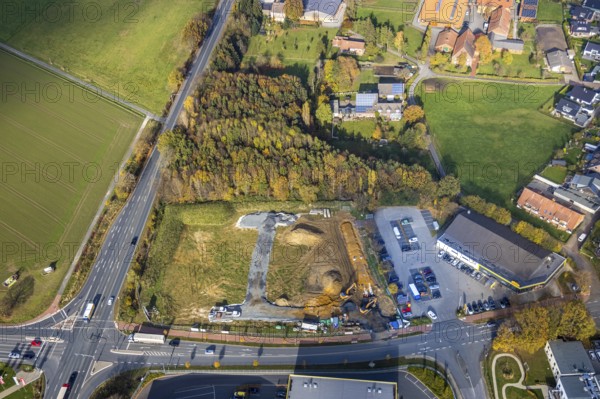 Aerial view, construction area for Galerie Mensing at the intersection of Werler Straße and Unnaer Straße, Hamm, Ruhr area, North Rhine-Westphalia, Germany, construction work, construction, construction area, building site, building plots, construction project, construction site, DE, Europe, commercial enterprises, commercial area, commercial area, commercial location, commercial use, aerial view, aerial photography, aerial photography, new construction, overview, bird's-eye view, overview