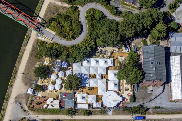 Aerial photo, Steinmeister's beer garden - Oskar am Kanal, Herne, Ruhr area, North Rhine-Westphalia, Germany, distance rule, beer garden, bridge, café, corona crisis, corona measures, corona virus, corona fear, Covid-19, DE, Europe, inn, gastronomy, hygiene measures, aerial view, aerial photography, aerial photography, Rhine-Ruhr metropolitan region, pandemic fear, Parrot Bridge - Unser Fritz, restaurant, Rhine-Herne Canal, parasols, overview, virus, bird's eye view, Zur Künstlerzeche, birds-eyes view, overview