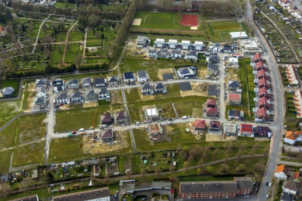 Aerial view, housing estate development area Auf dem Beisenkamp, Eschenallee, sports field Beisenkamp, Hamm, Ruhr area, North Rhine-Westphalia, Germany, construction work, construction area, building site, building plots, construction crane, construction project, construction site, DE, home, single-family houses, development, Europe, property tax, real estate, capacity requirements, aerial view, aerial photography, aerial photography, new build, terraced houses, overview, bird's-eye view, housing estate, housing and living, residential area, residential buildings, residential quality, residential neighbourhood, housing estate, birds-eyes view, overview