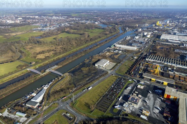 Aerial view, industrial area harbour Hamm between Hugo Schneider GmbH and Lanfer, Datteln-Hamm canal, river Lippe, Lippepark, bridge building in Lippepark, Hamm, Ruhr area, North Rhine-Westphalia, Germany, bridge, DE, Europe, river, river course, commercial area, commercial park, commercial use, industrial plants, industrial area, industrial site, canal, Lippe bridge, aerial view, aerial photography, aerial photography, production plants, production halls, overview, bird's eye view, birds-eyes view, overview