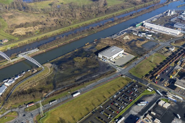 Aerial view, industrial area harbour Hamm between Hugo Schneider GmbH and Lanfer, Datteln-Hamm canal, river Lippe, Lippepark, bridge building in Lippepark, Hamm, Ruhr area, North Rhine-Westphalia, Germany, bridge, DE, Europe, river, river course, commercial area, commercial park, commercial use, industrial plants, industrial area, industrial site, canal, Lippe bridge, aerial view, aerial photography, aerial photography, production plants, production halls, overview, bird's eye view, birds-eyes view, overview