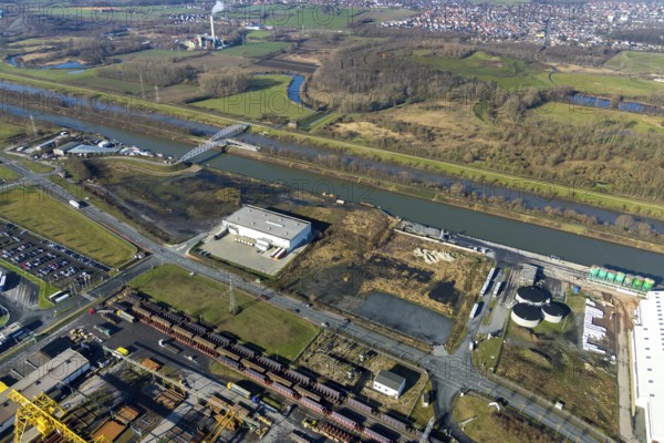 Aerial view, industrial area harbour Hamm between Hugo Schneider GmbH and Lanfer, Datteln-Hamm canal, river Lippe, Lippepark, bridge building in Lippepark, Hamm, Ruhr area, North Rhine-Westphalia, Germany, bridge, DE, Europe, river, river course, commercial area, commercial park, commercial use, industrial plants, industrial area, industrial site, canal, Lippe bridge, aerial view, aerial photography, aerial photography, production plants, production halls, overview, bird's eye view, birds-eyes view, overview