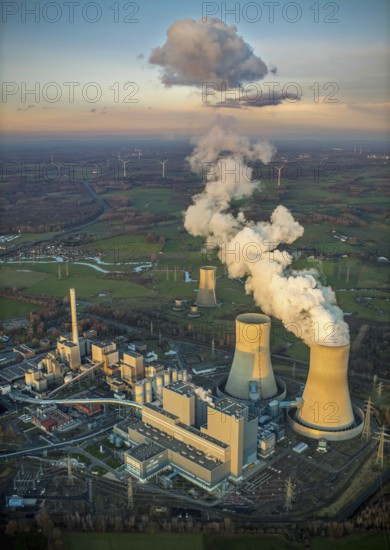 Aerial view, RWE power plant Westfalen, Schmehausen, power plant shutdown, Uentrop, Hamm, Ruhr area, North Rhine-Westphalia, Germany, Welver, DE, Europe, birds-eyes view, aerial photography, aerial photography, overview, overview, bird's eye view, former THTR, nuclear power plant, nuclear power plant, fossil energy, coal-fired power plant, cooling tower, landscape, emission, pollution, smoke cloud, evening sun, night shot, twilight shot, Hamm at night