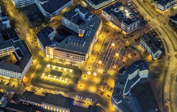 Aerial view, night view of Hamm main station, Bahbofsvorplatz, Hamm library, Platz der Deutschen Einheit, Bahnhofstraße, Neue Bahnhofstraße, Herlitz, Gustav-Heinemann-Straße, Heinrich-von-Kleist-Forum. VHS-Hamm, centre, Hamm, Ruhr area, North Rhine-Westphalia, Germany, DE, Europe, birds-eyes view, aerial view, aerial photography, aerial photography, overview, bird's-eye view, night view, twilight view, Hamm at night