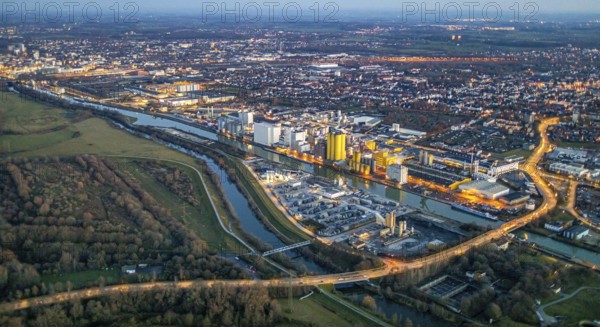 Aerial view, Hammer harbour, Datteln-Hamm canal. River Lippe, Brökelmann + Co, Ölmühle und Verwaltungs-GmbH, Brölio, Radbodstraße, Hafenstraße, Bockum-Hövel, Hamm, Ruhr area, North Rhine-Westphalia, Germany, DE, Europe, birds-eyes view, aerial photograph, aerial photography, aerial photography, overview, overview, bird's eye view, night shot, twilight shot, Hamm at night