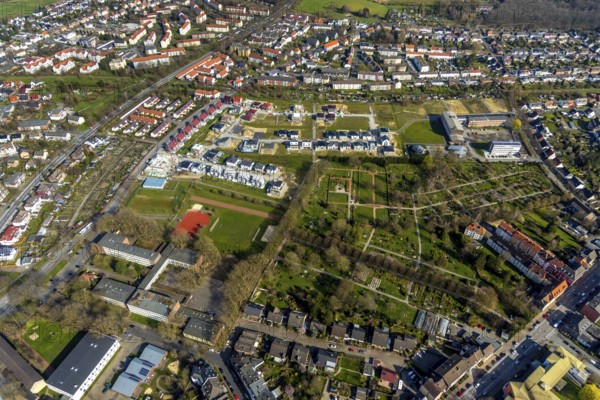 Aerial view, housing estate development area Auf dem Beisenkamp, Eschenallee, Beisenkamp Gymnasium Hamm, sports field Beisenkamp, Hamm, Ruhr area, North Rhine-Westphalia, Germany, construction work, construction area, building site, building plots, construction crane, construction project, construction site, burial site, education, educational institution, DE, home, single-family houses, development, Europe, cemetery, memorial site, Gottesacker, property tax, graves, burial ground, grammar school, real estate, capacity requirements, teaching institute, aerial photograph, aerial photography, aerial photography, new build, terraced houses, resting place, school, south cemetery, overview, bird's-eye view, residential complex, living and life, residential area, residential buildings, residential quality, residential neighbourhood, housing estate, birds-eyes view, overview