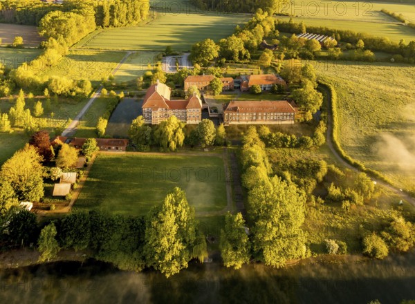 Aerial view, morning fog, Lippe river meadow, landscape in backlight, Oberwerries Castle, Hamm, Ruhr area, North Rhine-Westphalia, Germany, ground fog, castle, DE, Europe, river Lippe, river meadow, backlight, green trees, manor house, manor house, manor house, landscape, aerial view, aerial photography, aerial photography, fog, castle, castle complex, castle garden, castle park, overview, bird's eye view, moated castle, moated castle, meadows and fields, birds-eyes view, overview