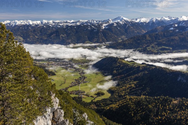 Snow on mountain range, fog over the village of Gröbming, view from Stoderzinken near Gröbming, Styria, Austria