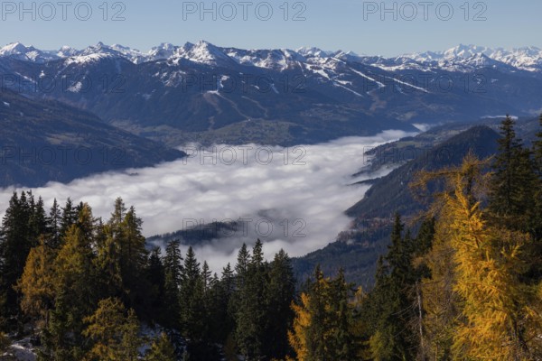 Autumn atmosphere, fog over the Enns Valley, snow on alpine mountain range, autumn leaves, view from Stoderstraße, near Gröbming, Styria, Austria