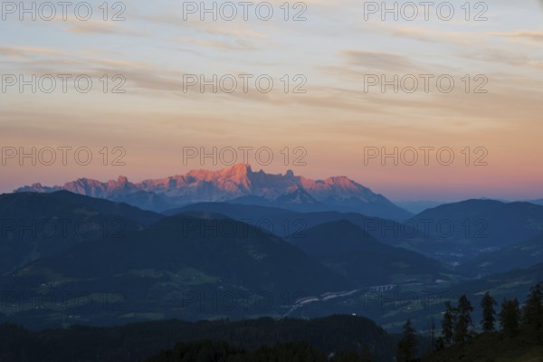 View from Mitterfeldalm to Hoher Dachstein at sunset, the Tauern motorway in the valley, Salzburg state, Austria